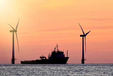 Image of a ship and wind turbines